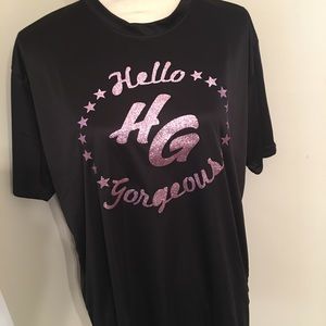 Polyester blend smooth fit. Nice glitter front. Tagless